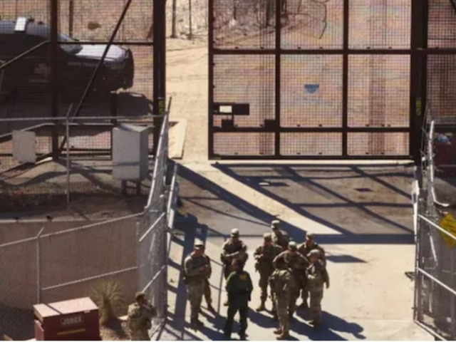 A US Customs and Border Protection officer briefed US soldiers at Gate 40 along the US-Mexico border wall in El Paso, Texas.